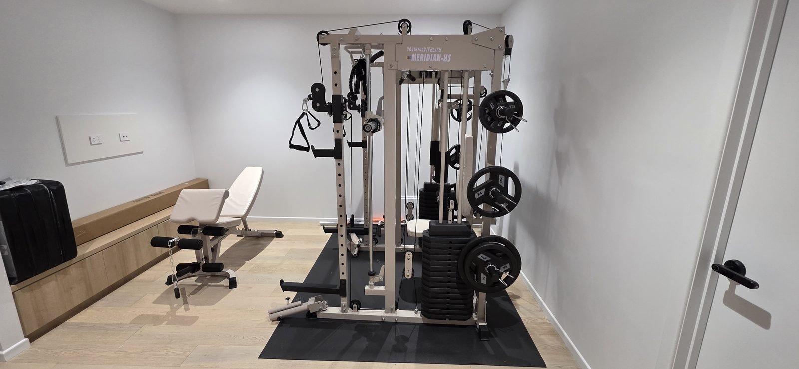 Home gym functional trainer and bench assembled and set up