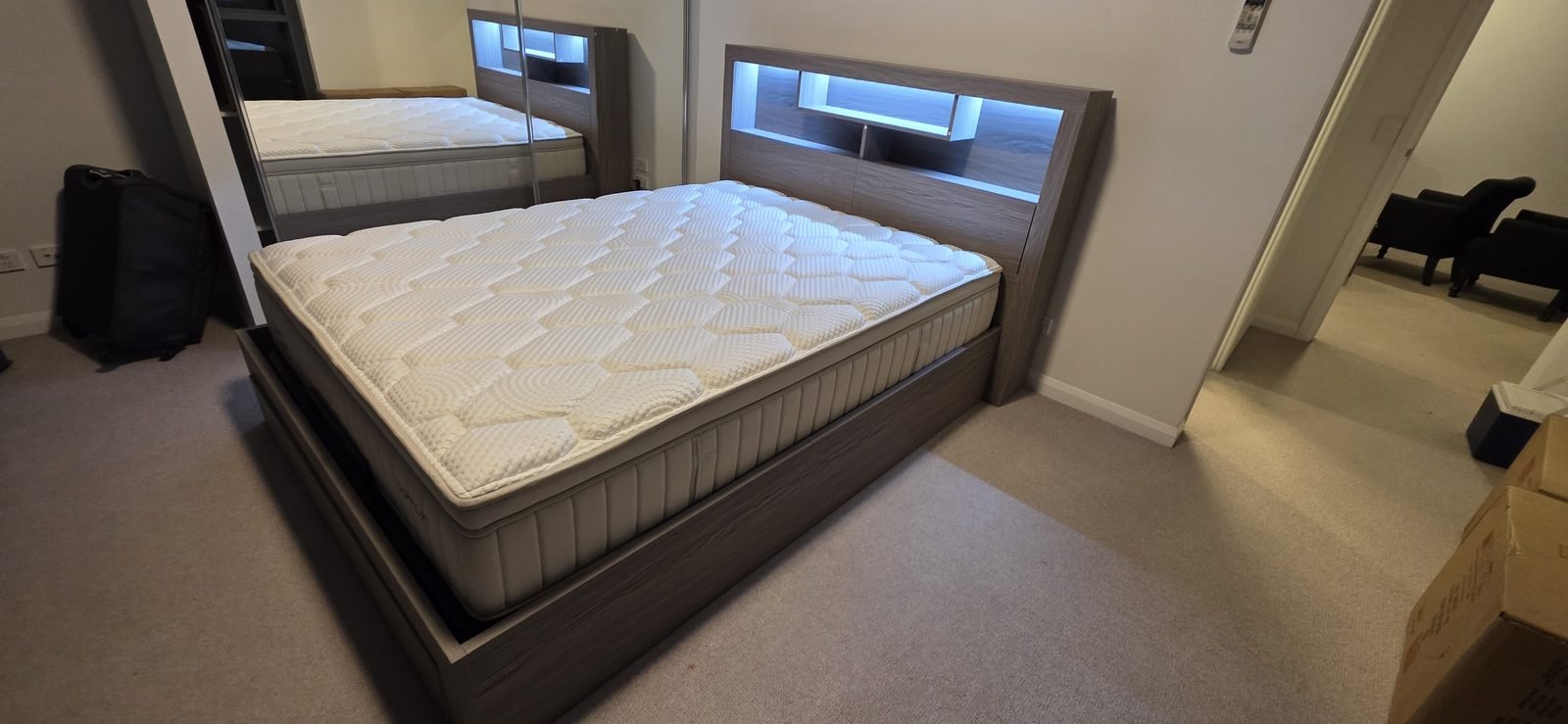 Flat pack bed frame with LED headboard assembled in a Brisbane bedroom