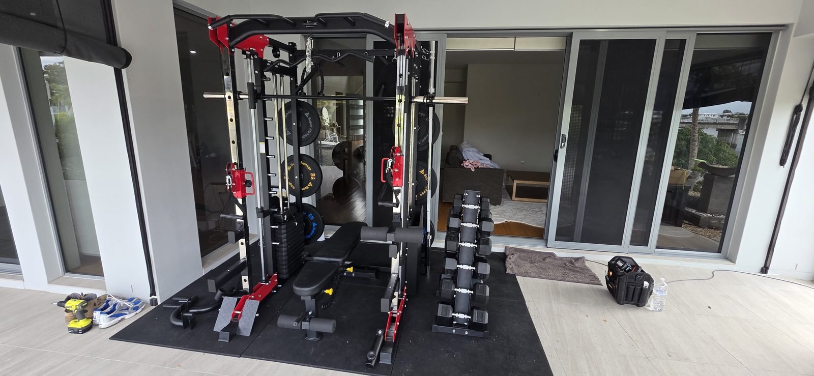 Completed home gym build with power rack and storage