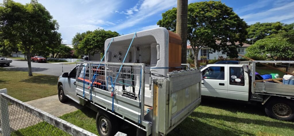 Large spa strapped onto the Need A Hand caged ute for transport